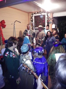Here is a scene from one of our stops on the posada.  Our pastor (wearing the sombrero) leads the members of the house in singing the part of the innkeeper.  In the foreground, Mary, Joseph, shepherds, angels, the Three Kings, guitar players, and the rest of us in the peanut gallery plead for a room at the inn.